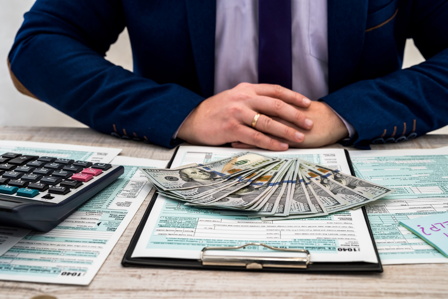 businessman-fills-out-individual